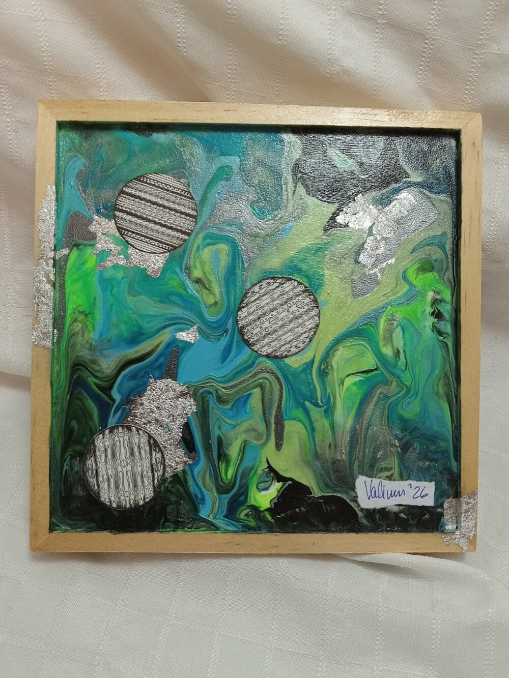 Collage on a liquid art panel, mixted media acrylic with silver foil